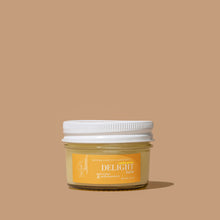 Load image into Gallery viewer, A jar of DELIGHT balm skincare product against a neutral background.