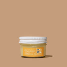 Load image into Gallery viewer, Back of Delight jar, skincare product on beige background.